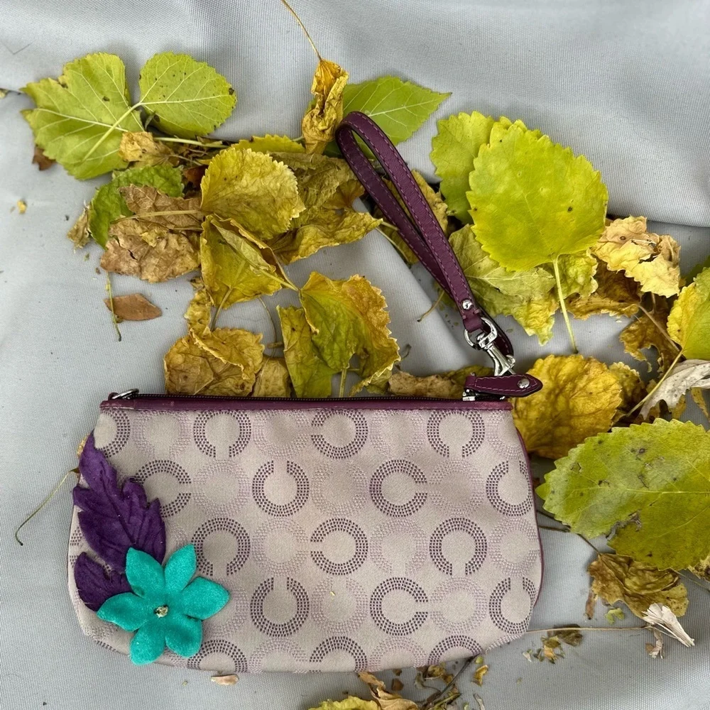 Coach Wristlet with suede flowers. Upstyled for a fresh new look. 9.25x5.5 x1”